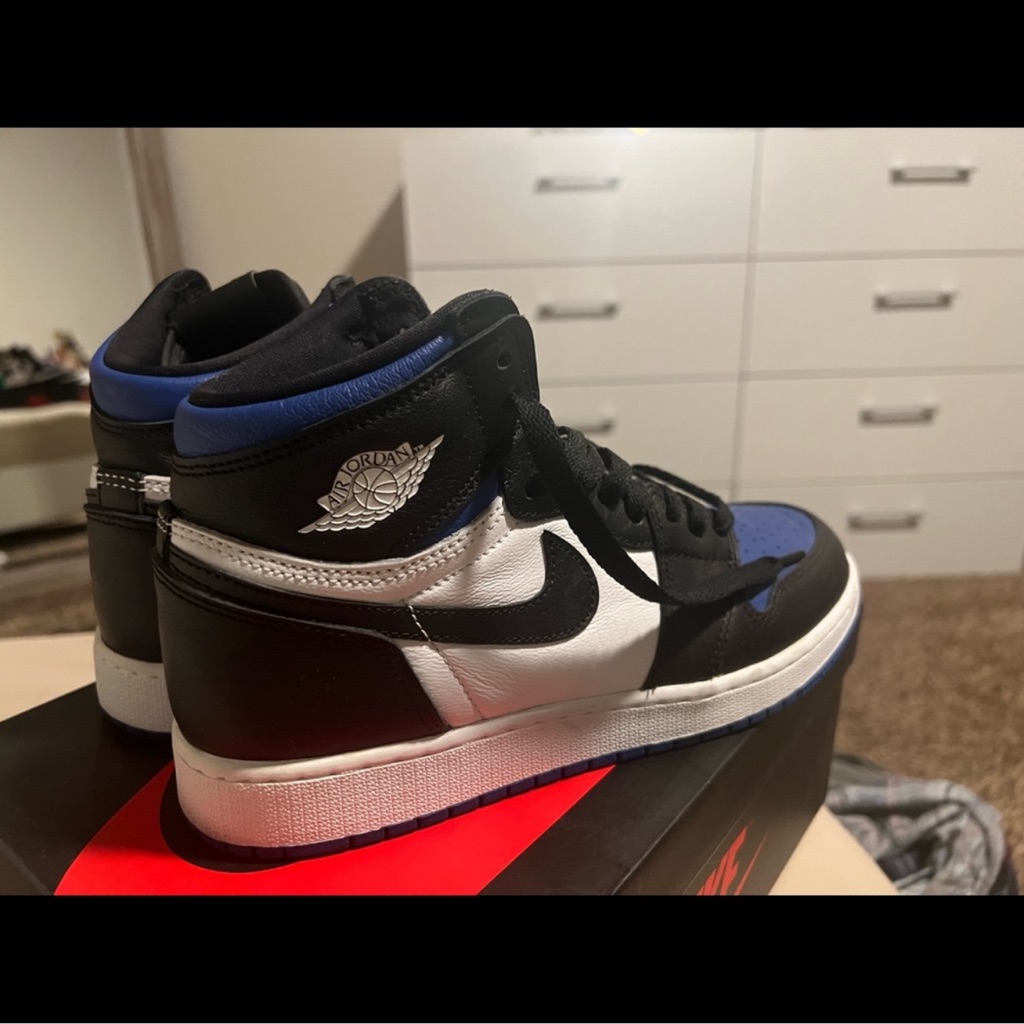 Nike Air Jordan High Tops In Black, White, And Blue
